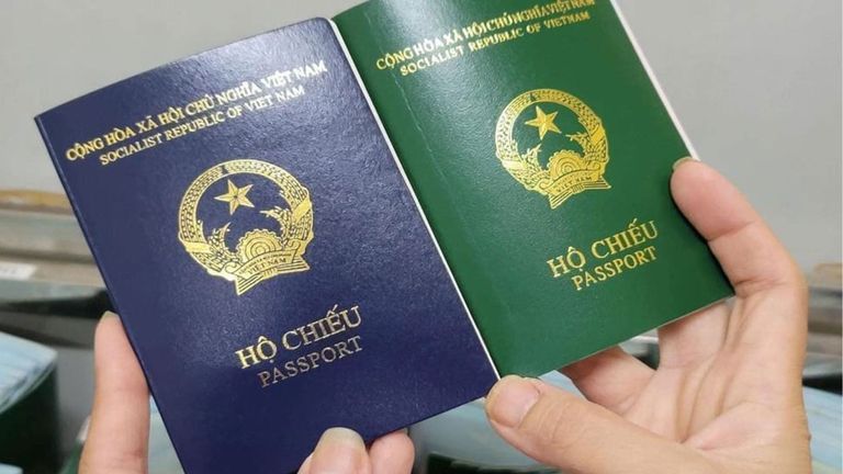 The new passport has a navy-blue cover, compared to the old green one.