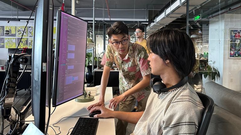 Andy Teh (wearing glasses) alongside his colleague at Shuttlerock Vietnam | Source: Andy Teh