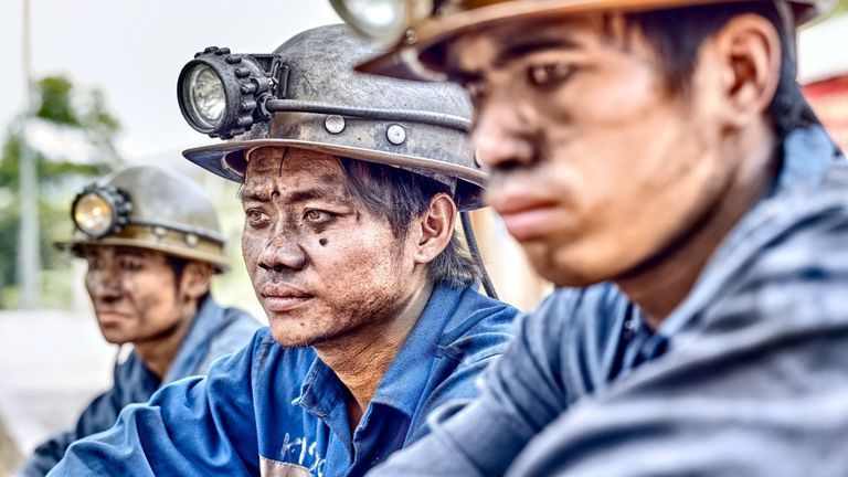 Coal mine workers in Vietnam. | Source: Shutterstock