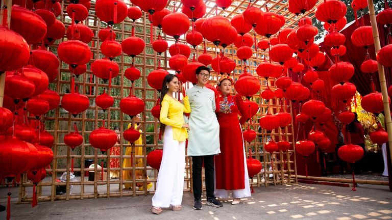 Tet is the most beautiful time of the year, as streets are filled with red lanterns, yellow apricot blossom and elegant áo dài. | Source: Bobby Vu for Vietcetera