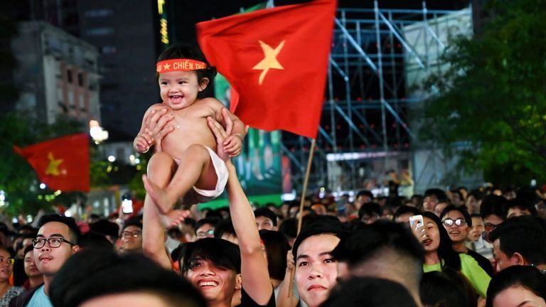 Vietnamese celebrate the country's win against Thailand at the U-23 football match on May 22. | Source: Tin Phung for Vietcetera